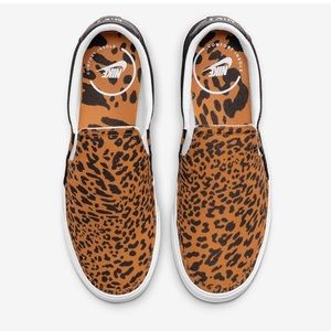 Women NEW Nike canvas animal print slip ons in size 9!